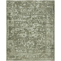 a rug with an abstract design on the top and bottom, in light green tones