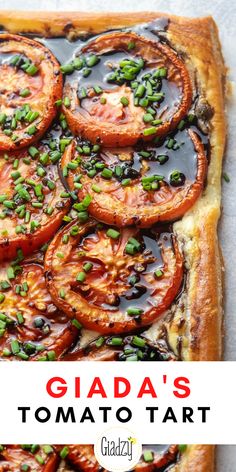 a tomato tart with green onions on top and the words glada's tomato tart