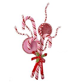 some candy canes and candies on a white background