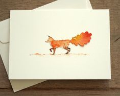 a card with an image of a fox on it's back and leaves in its tail