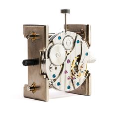 an old watch movement is shown on a white background