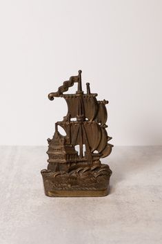 a bronze statue of a sailing ship