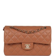 This Chanel Small Classic Double Flap is in Caramel Lambskin with Gold hardware, front flap with CC turnlock closure, half moon back pocket and adjustable interwoven gold chain link and lambskin leather shoulder/crossbody strap. The interior is lined in Caramel leather and features a small zip pocket with Chanel pull and slip pocket underneath on the rear wall.Collection: 2022 (RFID chip)Origin: FranceCondition: New and never worn (plastic on hardware) Accompanied by: Chanel Box, Chanel dustbag, Classic Camel Bags With Detachable Strap, Elegant Brown Bag With Cc Turnlock Closure, Classic Cognac Flap Bag With Soft Leather, Classic Cognac Soft Leather Flap Bag, Elegant Brown Flap Bag With Cc Turnlock Closure, Luxury Caramel Shoulder Bag With Detachable Strap, Classic Beige Double Flap Bags, Luxury Brown Flap Bag With Leather Lining, Luxury Camel Bag With Detachable Strap