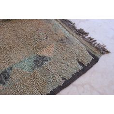 a rug with an animal design on the bottom and fringes around it's edges