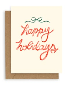 a card with the words happy holidays written in red and green ink on top of it