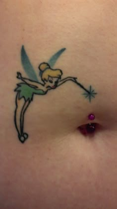 a woman's stomach with a small tinkerbell tattoo on it