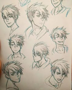 a hand holding up a sheet of paper with sketches of different faces and hair styles