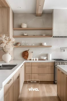 the kitchen is clean and ready for us to use it's natural wood accents