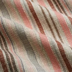 the fabric is striped with red and brown stripes