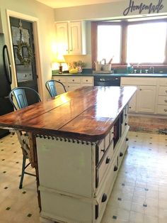 a kitchen island made out of an old table