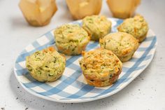 several muffins on a blue and white checkered plate