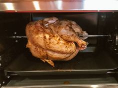 a whole chicken is being cooked in an oven