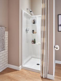 a bathroom with a shower and toilet in it