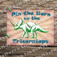 a sticker that says, pin the horn on the tricerops with an image of