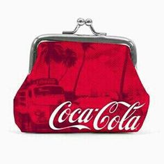 a coca cola purse with a bus and palm trees in the background on a white background