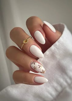 Embrace the clean girl aesthetic with these 25 simple and chic white nail ideas! Whether you prefer minimalistic charm or more elaborate designs, there's something for everyone. We just love these creamy almond shaped nails with beige flower art. Milky Nails, Colorful Nails, Her Nails, White Nail Designs, Thanksgiving Nails, Stick On Nails, Elegant Nails, Nail Accessories