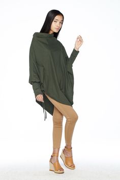 "🚚..ALL ORDERS ARE SHIPPED VIA DHL EXPRESS MAIL This batwing tunic is a very \"cool\" addition to any wardrobe! With a unique drawstrings on bottom hem of tunic provide plenty of options for changing the look. Cowl neckline, batwing sleeves with wide cuffed and oversized side pocket; can be worn layered over leggings, pants, or skirt for even more dramatic effects. * Pull-on style * Cowl neckline * Dropped shoulders * Long sleeves with wide ribbed cuff * Oversize side pocket * Asymmetrical hem Casual Solid Asymmetrical Sweater, Casual Asymmetrical Sweater, Spring Batwing Sleeve Solid Outerwear, Oversized Tops With Asymmetrical Hem In Solid Color, Oversized Solid Color Tops With Asymmetrical Hem, Fall Crew Neck Tops In Lagenlook Style, Fall Crew Neck Lagenlook Tops, Fall Lagenlook Crew Neck Tops, Oversized Asymmetrical Spring Sweater