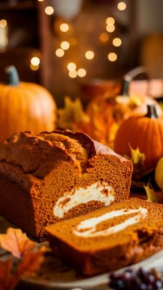 slices of pumpkin bread on a plate with fall leaves and pumpkins in the background