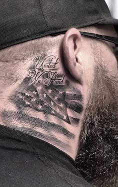 a man with a beard and an american flag tattoo on his neck