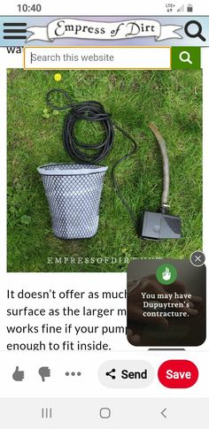 a cell phone with an image of a wire in the grass next to a bucket