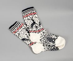 socks white men wool black reindeer folklore eco friendly white sock foot unisex  Ready to ship!  I designed these white-black-red wool one of kind socks with high ankles.  They are handmade from a 100% lambswool.  Measure the length of your foot and add up to ½ inch (or 1.25 cm).  SIZE: Socks length: 10.4 inches (26.5 cm). Width at the widest point: 4.1 inches (10.5 cm). Ankle length: 10.2 inches (26 cm) Ankle width at the widest point: 4.7 inches (12 cm)  CARE: You can wash your socks in 86 Fahrenheit (30 Celcius) with cold hand wash.   If you need a gift wrapping, send me a notice, when You buy the socks!  Thank you for visiting my shop! Cozy White Socks For Gifts, Cozy White Socks As Gift, Cozy White Socks As A Gift, White Socks For Winter Gifts, White Winter Socks As Gift, White Winter Gift Socks, Handmade White Socks For Gifts, Handmade White Socks As Gift, Handmade White Socks For Gift