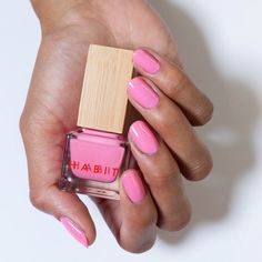 What is it? Dollhouse is a bright bubblegum pink nail infused with bright pink shimmer. Barbie vibes! Why you'll love it: A healthier Habit, our nail polish is made with a vegan, cruelty-free, toxin-free formula and infused with Myrrh extract to improve nail strength Guilt-free packaging: Habit nail polish is the only polish packaged with recycled plastic components, biodegradeable bamboo overcaps to keep plastic use to a minimum, and FSC-certified paperboard boxes Trend relevant yet wearable co Pink Nail Polish Colors, Strengthening Nail Polish, Bubblegum Pink Nails, Indie Makeup Brands, Cruelty Free Nail Polish, Barbie Vibes, Indie Makeup, Wood Nails, Vegan Nail Polish