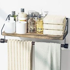 a towel rack with towels and soaps on it