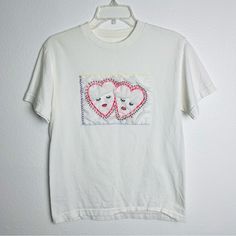 Handmade Embroidered T-Shirt. White Short Sleeve Crewneck. Hand-Stitched Hearts Design. Perfect For Valentines Day! Beautiful And One Of A Kind! Women’s Size Small. 100% Cotton. New Without Tags. Nwot Measurements: Bust 18” Across / Waist 18” Across / Length 25” White Cotton T-shirt With Heart Patch, Cotton Graphic Tee With Heart Patch, Cotton T-shirt With Heart Patch, Cotton T-shirt With Heart Patch, Short Sleeve, Cotton T-shirt With Heart Patch Short Sleeve, White Embroidered Heart-shaped Top, White Embroidered Tops With Heart Design, Embroidered Valentines, Embroidered Hearts