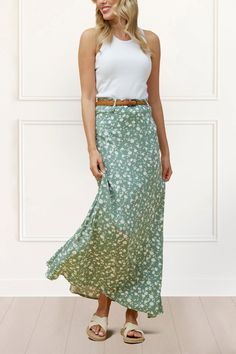 La Plus Aimée     Une élégance estivale décontractée et rafraîchissante avec notre jupe maxi la plus vendue, accompagnée d'une ceinture tissée. Arborant un adorable motif floral avec des fleurs blanches crémeuses imprimées sur un fond vert sauge et une ceinture tissée couleur tan.     Caractéristiques :﻿     Tissu : 100% Viscose  Longueur : 41 pouces  Couleur : Vert Sauge  Jupe maxi longue  Fermeture éclair invisible à l'arrière  Comprend une ceinture amovible  Imprimé floral Sage Skirt Outfit, Printed Maxi Skirt Outfit, Haul Ideas, Embroidery Dress Boho, Green Maxi Skirt, Summer Elegance, Long Skirt Summer, Robes D'occasion, Green Ground