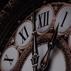 an ornate clock with roman numerals on it