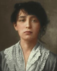 an old photo of a woman with dark hair