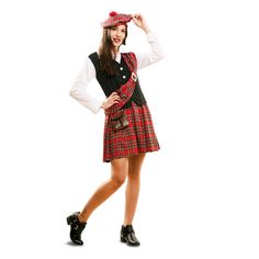 a woman in a kilt and hat posing for the camera