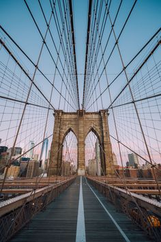 the brooklyn bridge in new york city during sunset