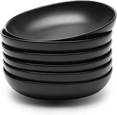 stack of black plates on white background with clipping path to the top one is empty