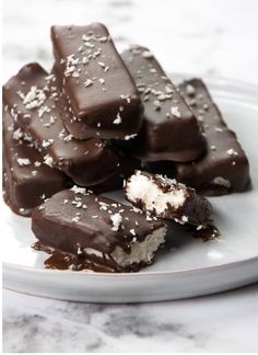 a plate full of pieces of chocolate with sea salt on top