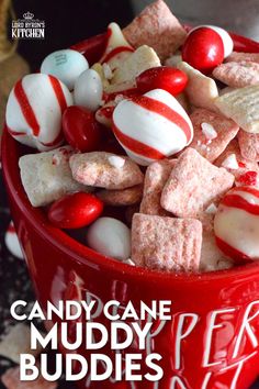 a red bowl filled with candy cane muddy buddies