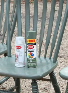 two chairs with spray paint sitting on top of them