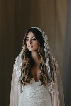 a woman in a wedding dress and veil