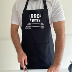 a man in an apron is cutting up some food