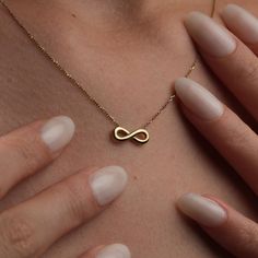 ✨ Capture Eternal Elegance: Discover Our Handmade 14K Gold Infinity Necklace ✨ 🌟 Step into a world of timeless elegance with our meticulously Handmade 14K Gold Infinity Necklace. Each piece is crafted with passion and precision, showcasing the artistry of our master jewelers and the allure of genuine 14K gold. This necklace isn't just an accessory--it's a symbol of infinite love, endless possibilities, and unwavering commitment. ✨ 🎁 Whether you're celebrating a milestone birthday, a special anniversary, or simply want to express your love and appreciation, our infinity necklace is the perfect choice. Its understated yet profound design speaks volumes, making it a cherished gift for her that she'll treasure for years to come. 💖 💫 Immerse yourself in the understated luxury of our infinit Gold Infinity Necklace, Infinity Symbol Necklace, Infinity Necklace Gold, Symbol Necklace, Necklace Elegant, Understated Luxury, Infinity Necklace, Anniversary Jewelry, Milestone Birthday