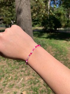 The Pretty in Pink Bracelet would make a perfect gift for a loved one or friend! Featuring clay beads in the colors of different shades of pink, as well as white and gold. * Handmade in Texas - and made to order! * Bracelet length: 6.75" (standard) Materials: Clay disc beads * Please measure your wrist before ordering as we do not offer returns or exchanges for resizing * You may request custom sizes in the personalization box. We can also make bracelets for children as well, but please measure their wrists for the most accurate fit. *These bracelets make great gifts for all occasions and are perfect for stacking or wearing alone! * All sales are final and no refunds will be issued. *Keep bracelet away from small children due to choking hazard *Keep bracelet dry and away from water and che Bohemian Pink Beads For Friendship, Adjustable Pink Beaded Friendship Bracelets, Pink Heishi Beads Beaded Bracelets, Pink Bohemian Beaded Bracelets With Heart Beads, Bohemian Pink Friendship Bracelets With Tiny Beads, Pink Bohemian Heishi Beads Bracelets, Handmade Pink Friendship Bracelets As Gift, Bohemian Pink Beaded Bracelets With Heart Beads, Bohemian Pink Heishi Beads Bracelets