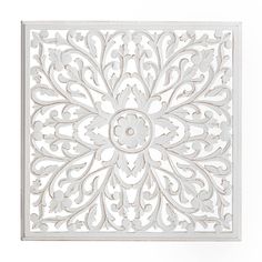 an intricately designed wall panel in white