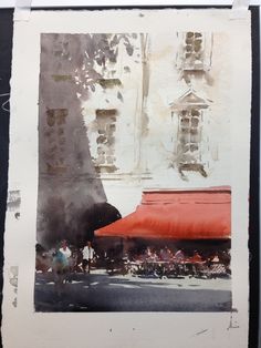 an old photo with people walking around in front of a red awning on the side of a building