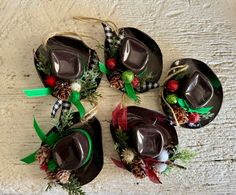 four chocolate cups decorated with pine cones and christmas decorations