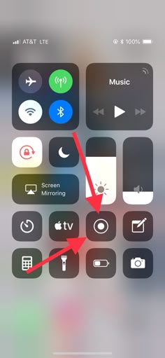 an iphone screen with the home button highlighted and arrow pointing to music icons on it