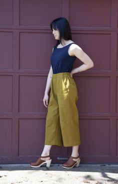 a woman standing in front of a garage door