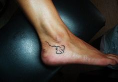 a person with a small tattoo on their foot