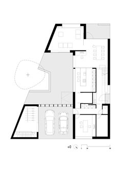 the floor plan for a house with two floors and three cars parked in front of it