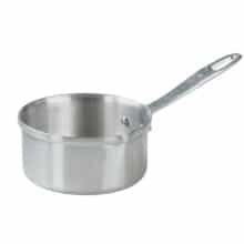 a stainless steel saucepan with a lid and spoon in the bottom, on a white background