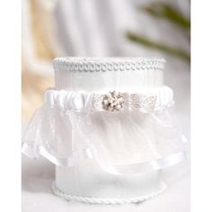 two white wedding garters on top of each other